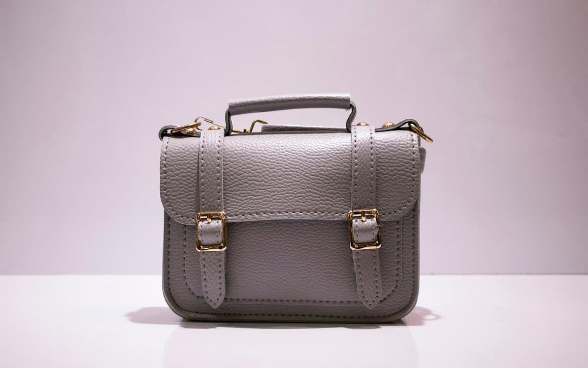 Structured gray leather satchel with gold hardware